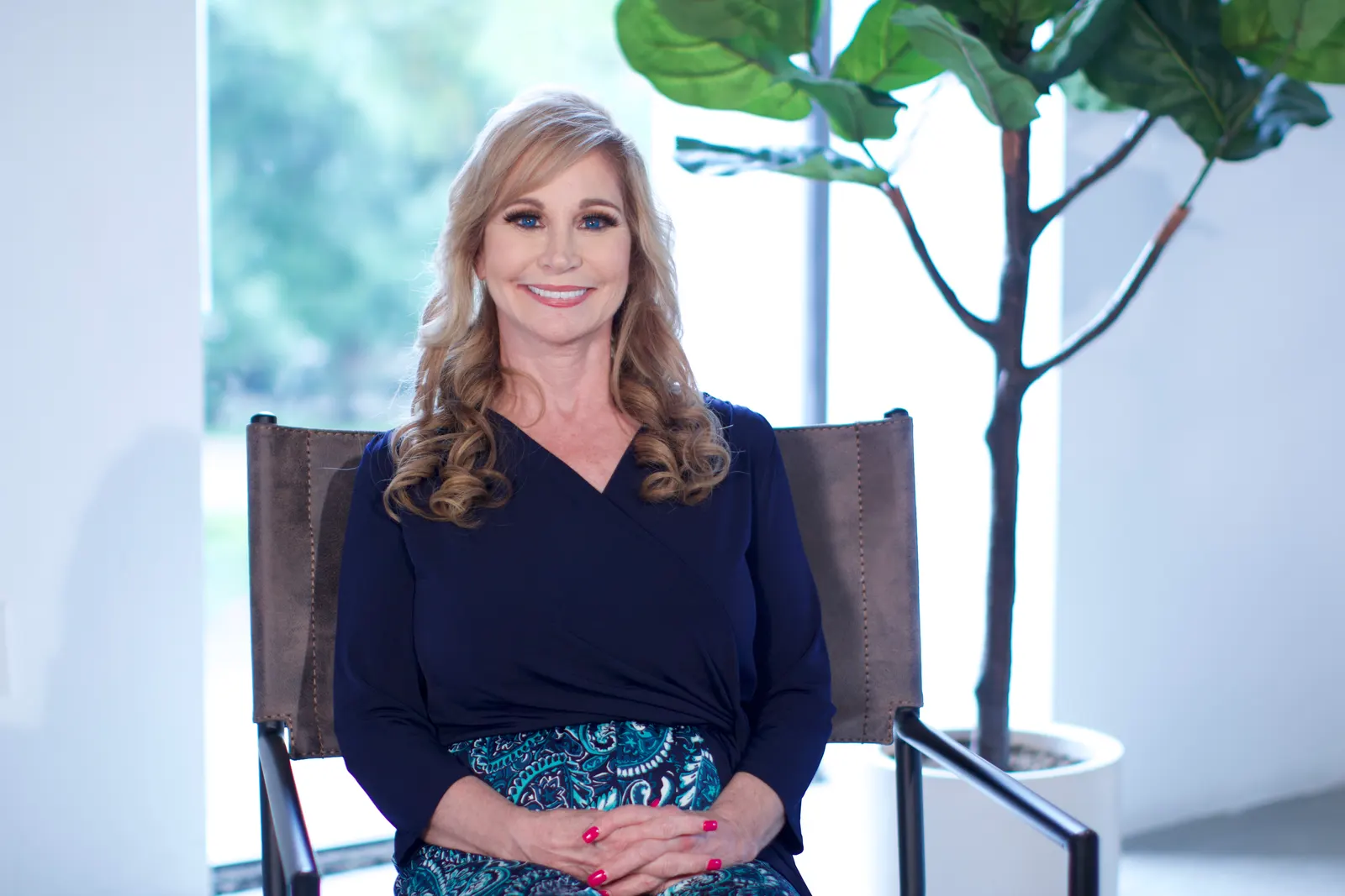 Debra George seated in a bright room
